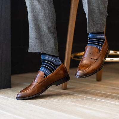 The Alvarados - A Blue, Black and White Striped Sock