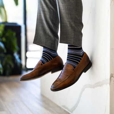 The Alvarados - A Blue, Black and White Striped Sock