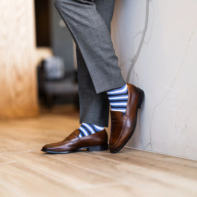 The Trevinos - A Blue, Black, and White Striped Sock