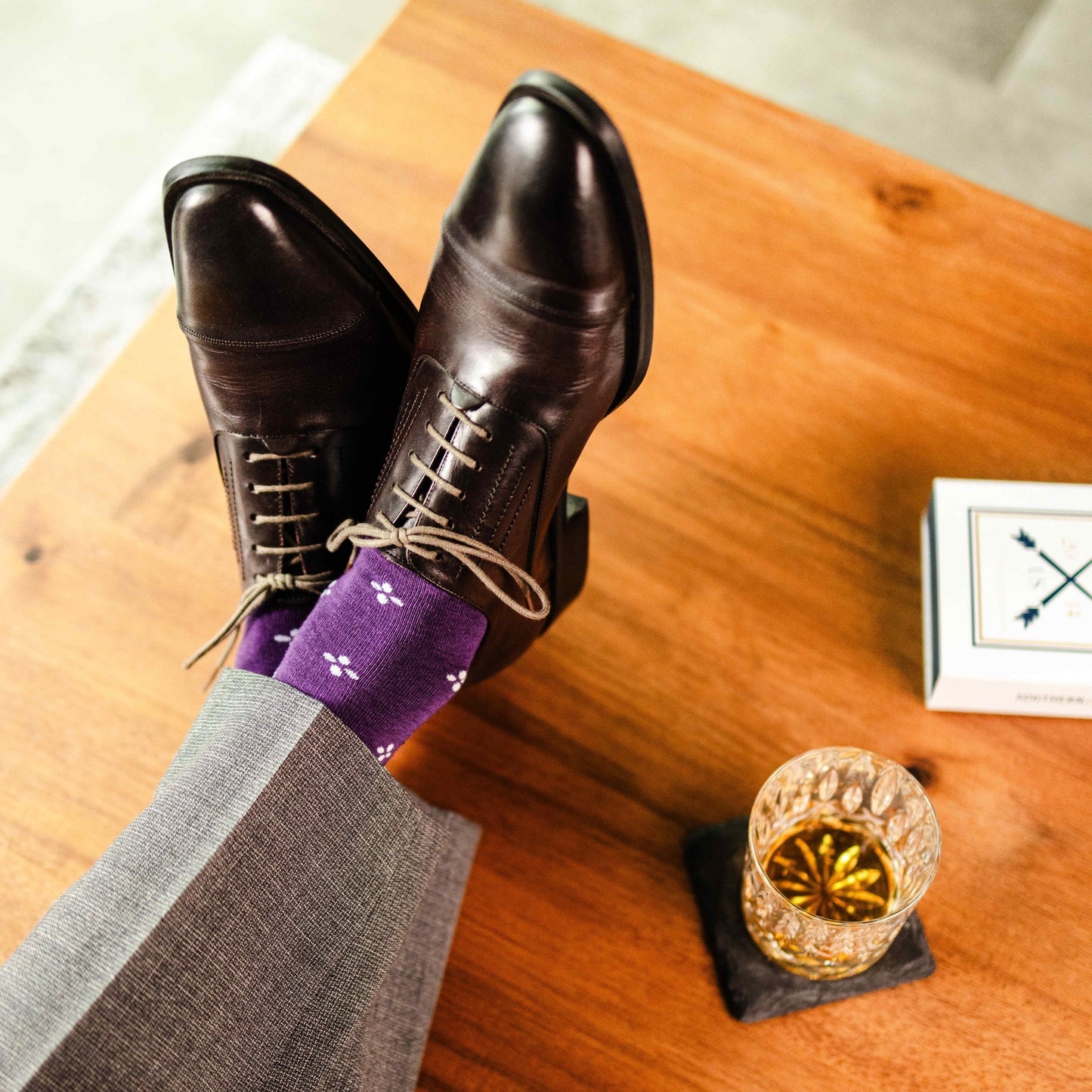 Purple men's dress sock with a white flower pattern