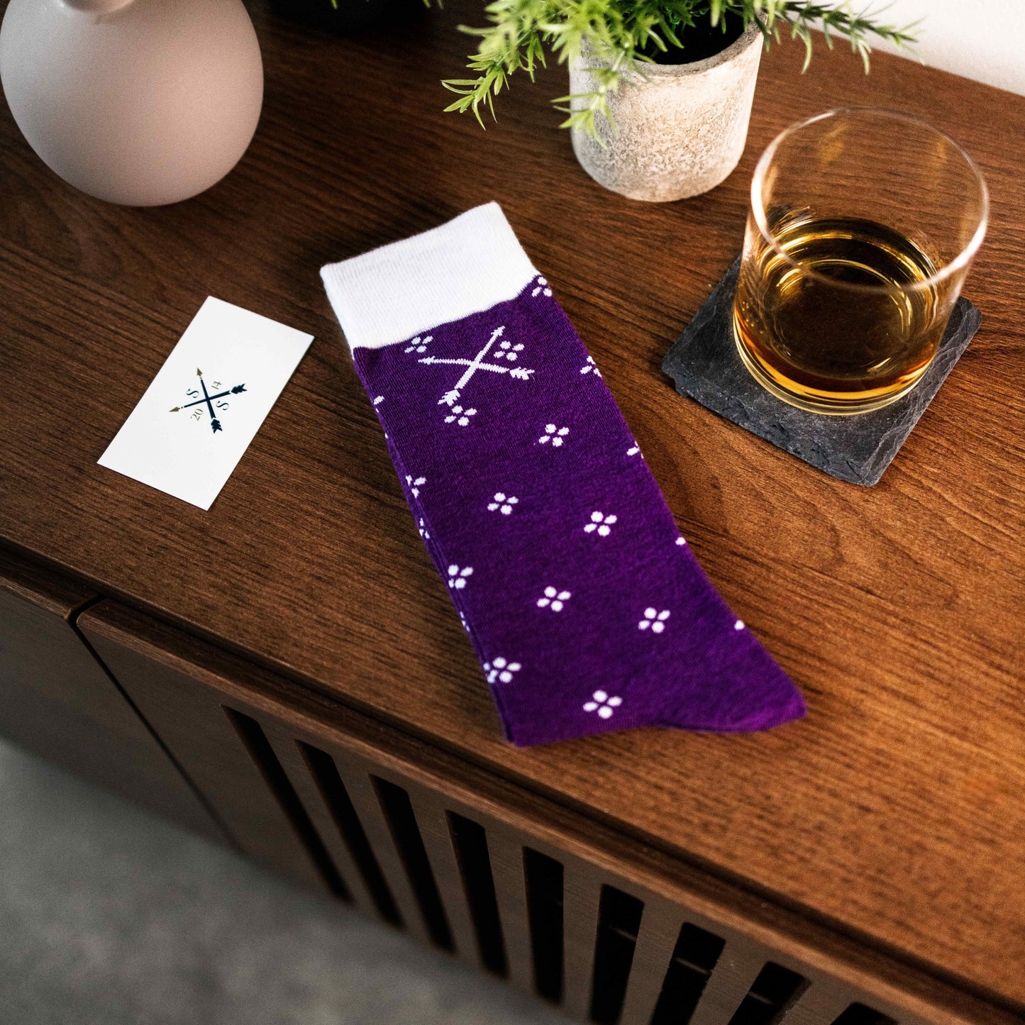 Purple men's dress sock with a white flower pattern