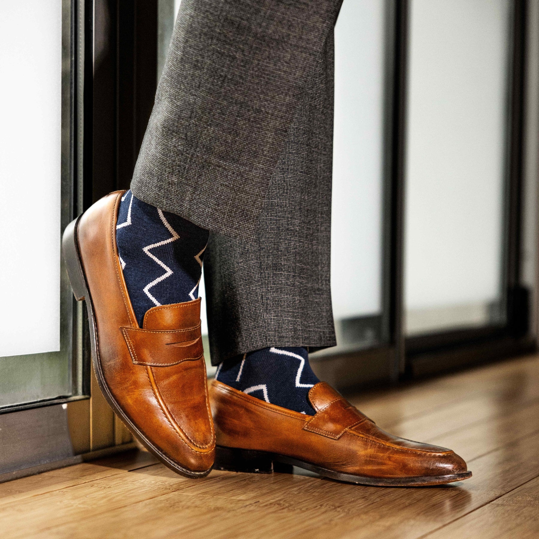 navy blue socks with a white zigzag pattern