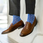Man wearing heathered blue men's dress sock with ocean blue micro squares with grey slacks and brown shoes