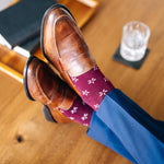 Deep red sock with a contrasting white firework pattern