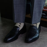 Gold men's dress sock with black rounded hatch pattern