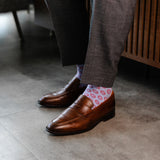 pale blue men's dress socks with a red double dot pattern