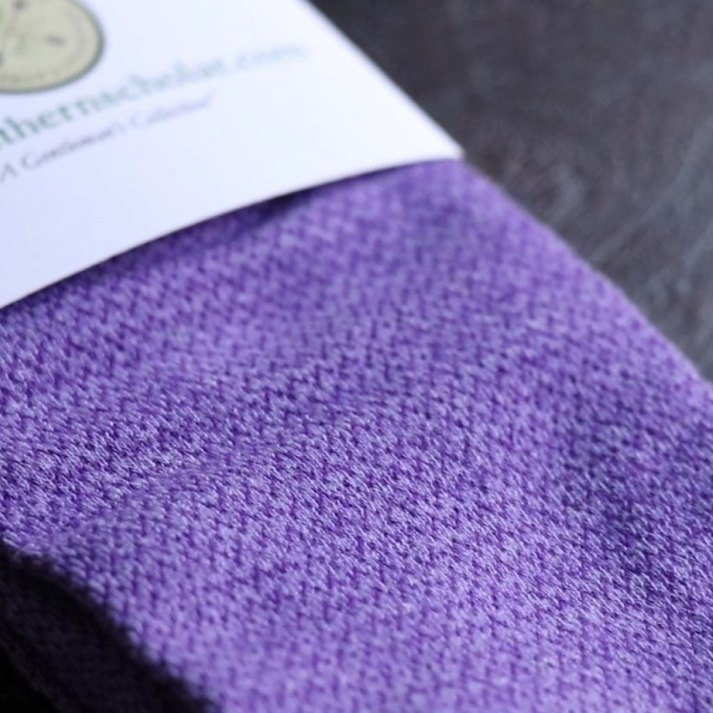 A purple men's dress sock with textured pattern