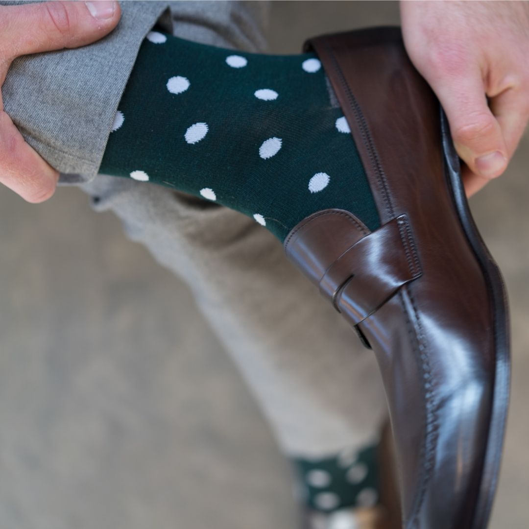 Man wearing green socks with white polka dots