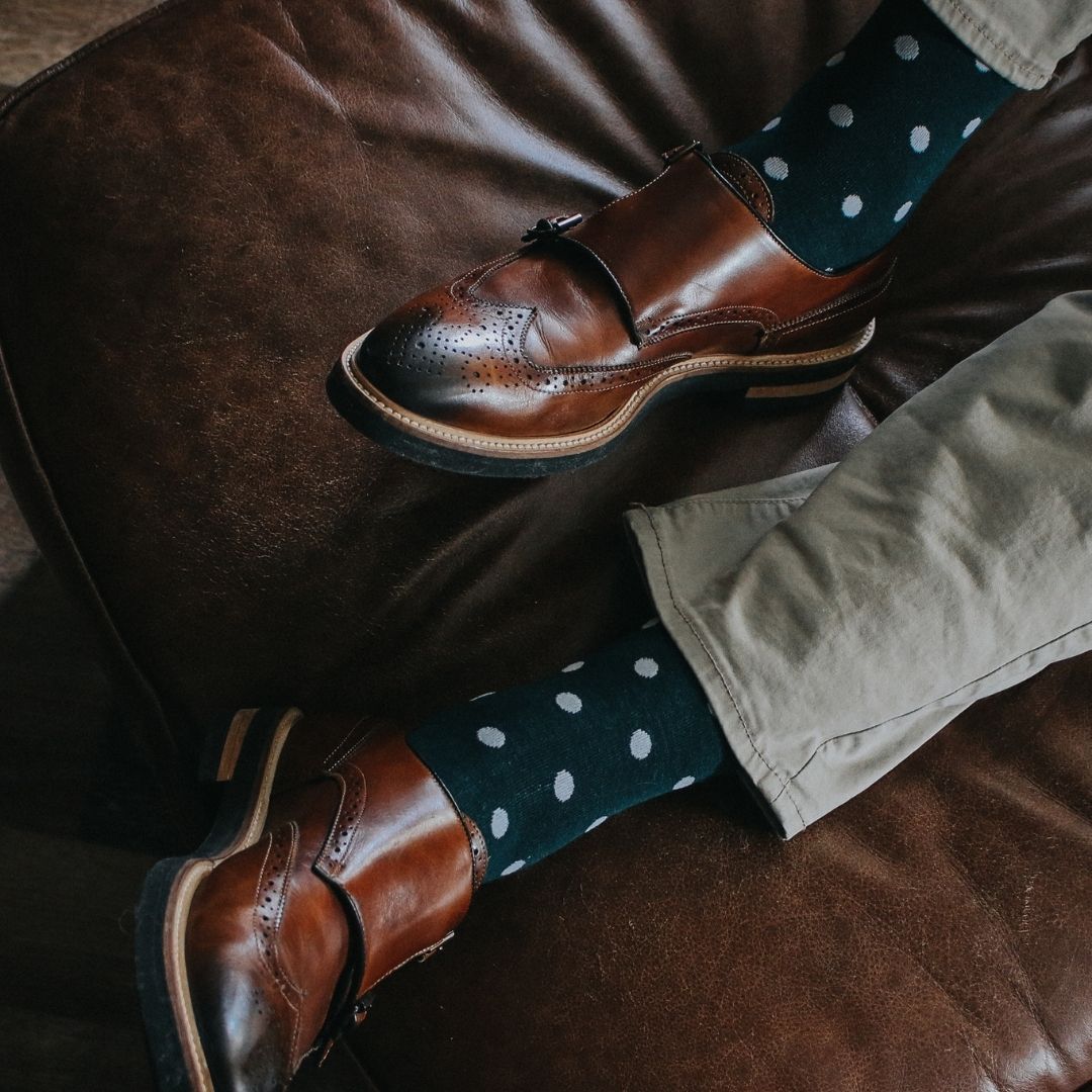 Man wearing green socks with white polka dots