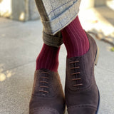 Man wearing solid, merlot ribbed men's socks with dress shoes.