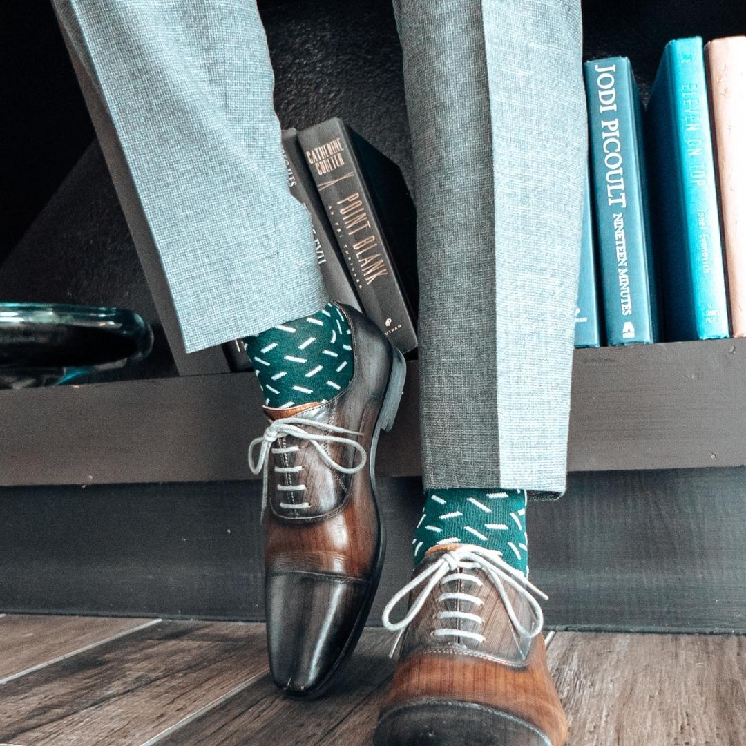 Hunter green men's dress sock with a contrasting sprinkle pattern