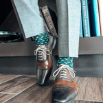 Hunter green men's dress sock with a contrasting sprinkle pattern