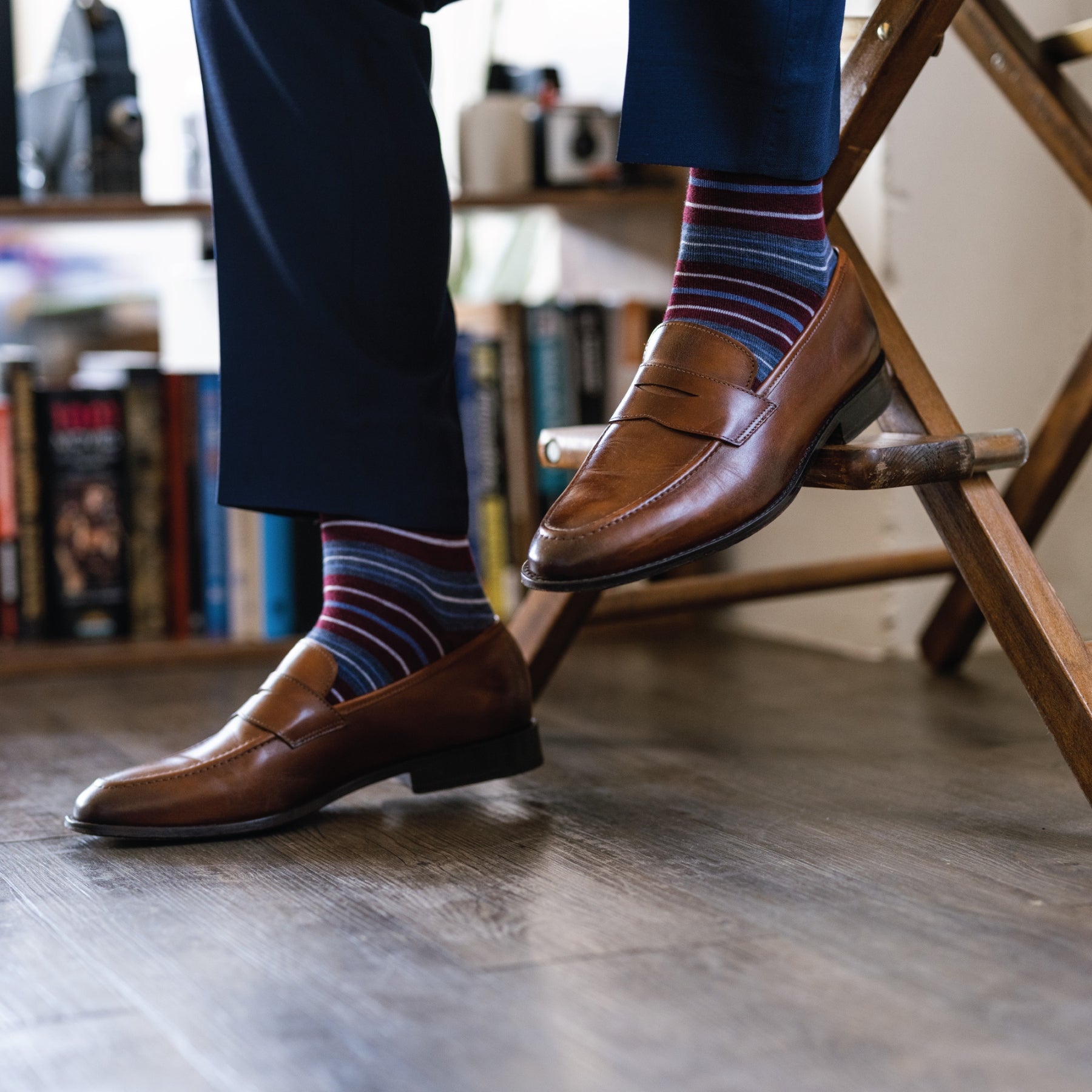 Deep red men's dress sock with blue and white stripes