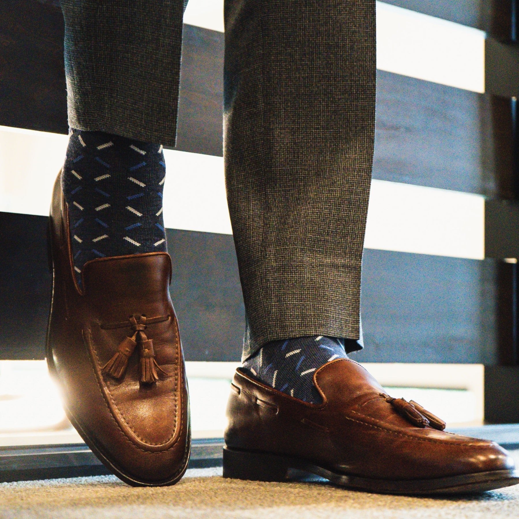 dark blue men's dress socks with light blue and white x pattern