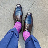 Man wearing fuchsia, solid, ribbed men's dress socks with brown shoes.