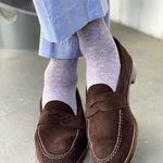 Guy wearing light grey men's dress socks with baby blue pin dot pattern