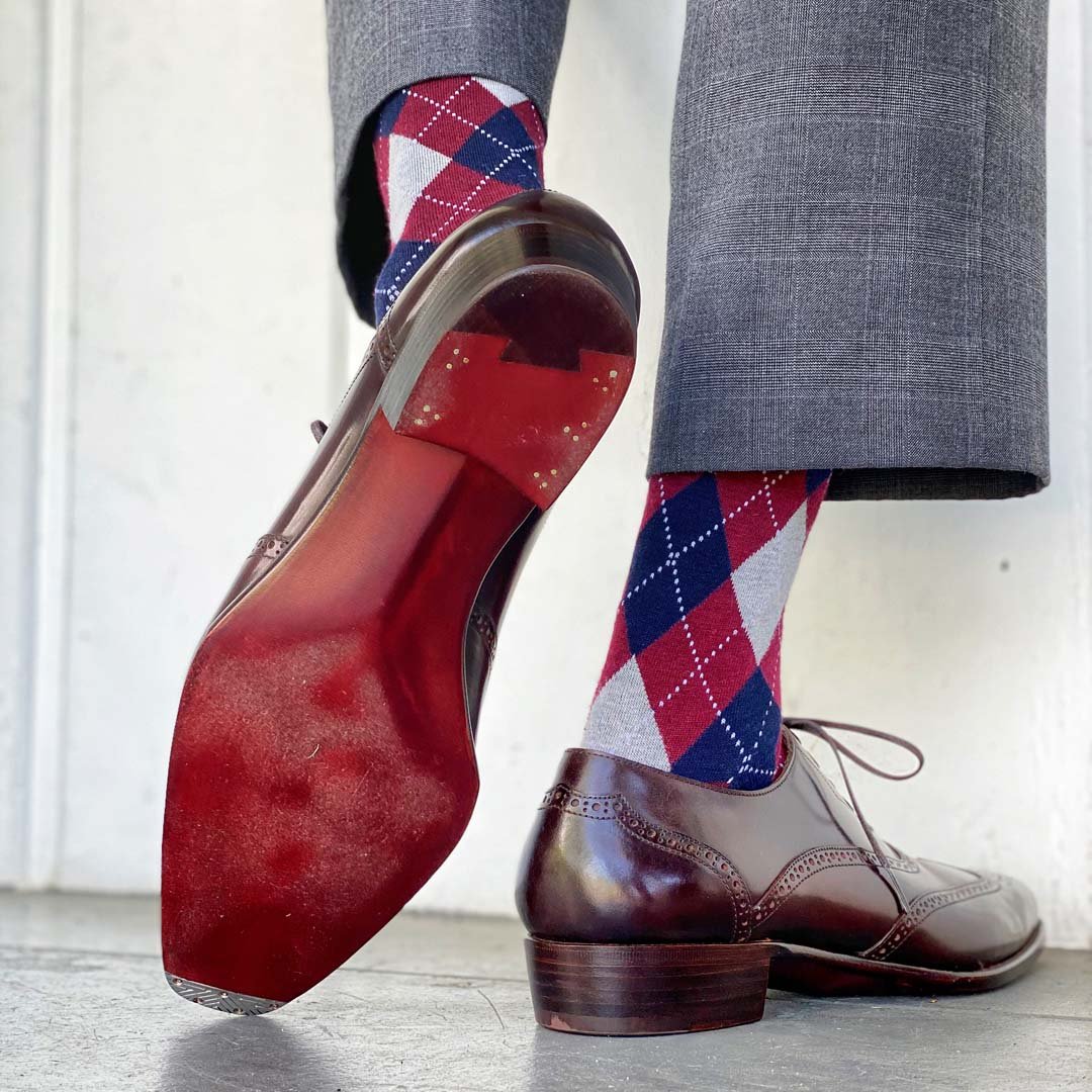 grey, red, and blue argyle socks