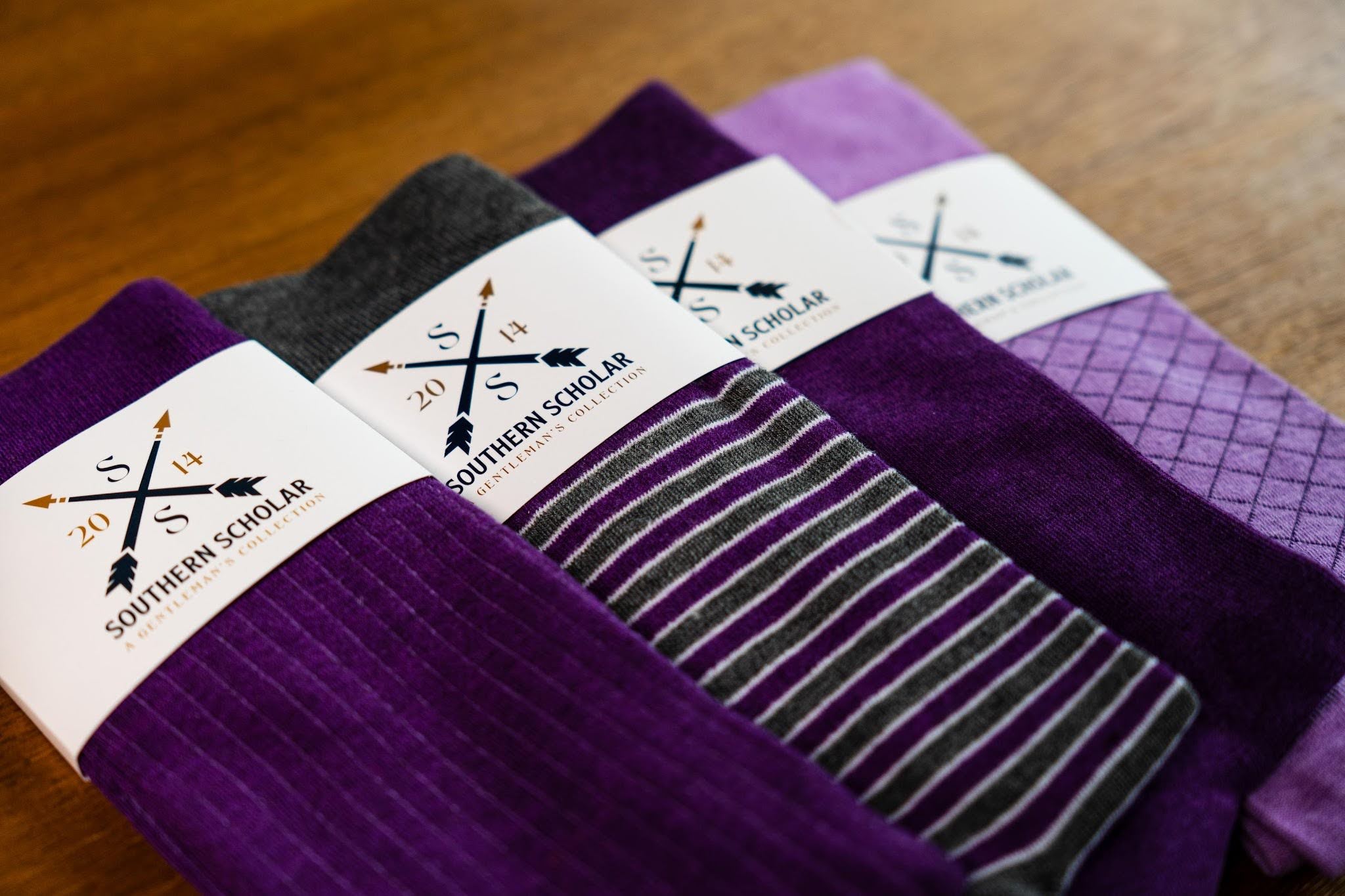 Collection of men's dress socks neatly arranged for storage and organization.