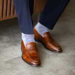 The Blue-Grey & Cobalt Square-Grid styled with navy trousers with brown penny loafers