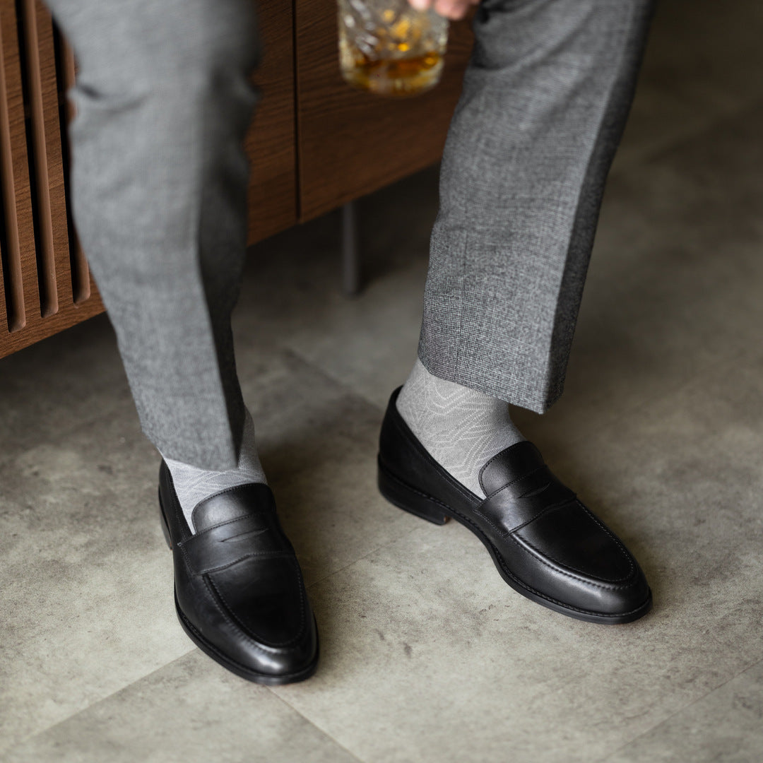 The Pearl Grey Square-Grid styled with medium grey trousers with black penny loafers