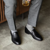 The Pearl Grey Square-Grid styled with medium grey trousers with black penny loafers