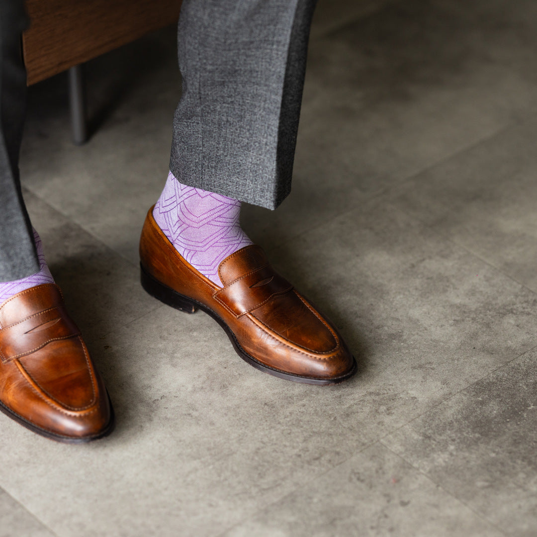 The Lavender & Plum Square-Grid dress sock with a loafer in a raised-foot close-up