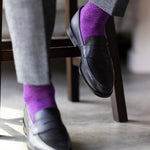 The Plum & Lavender Square-Grid dress sock with a loafer in a raised-foot close-up