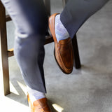The Blue-Grey & Cobalt Square-Grid dress sock with a loafer in a raised-foot close-up