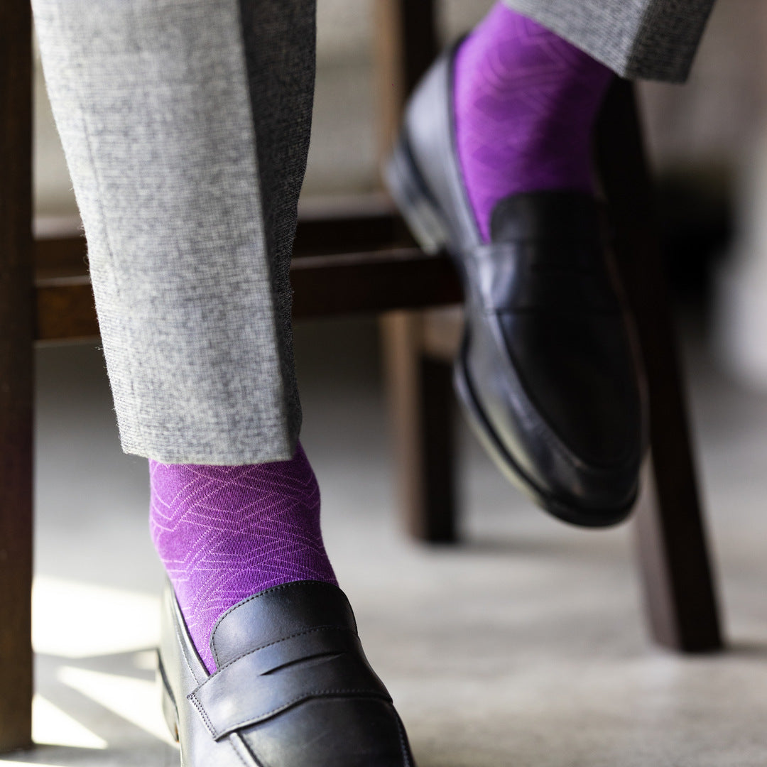 The Plum & Lavender Square-Grid dress sock with a loafer in a raised-foot close-up
