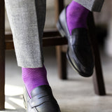 The Plum & Lavender Square-Grid dress sock with a loafer in a raised-foot close-up