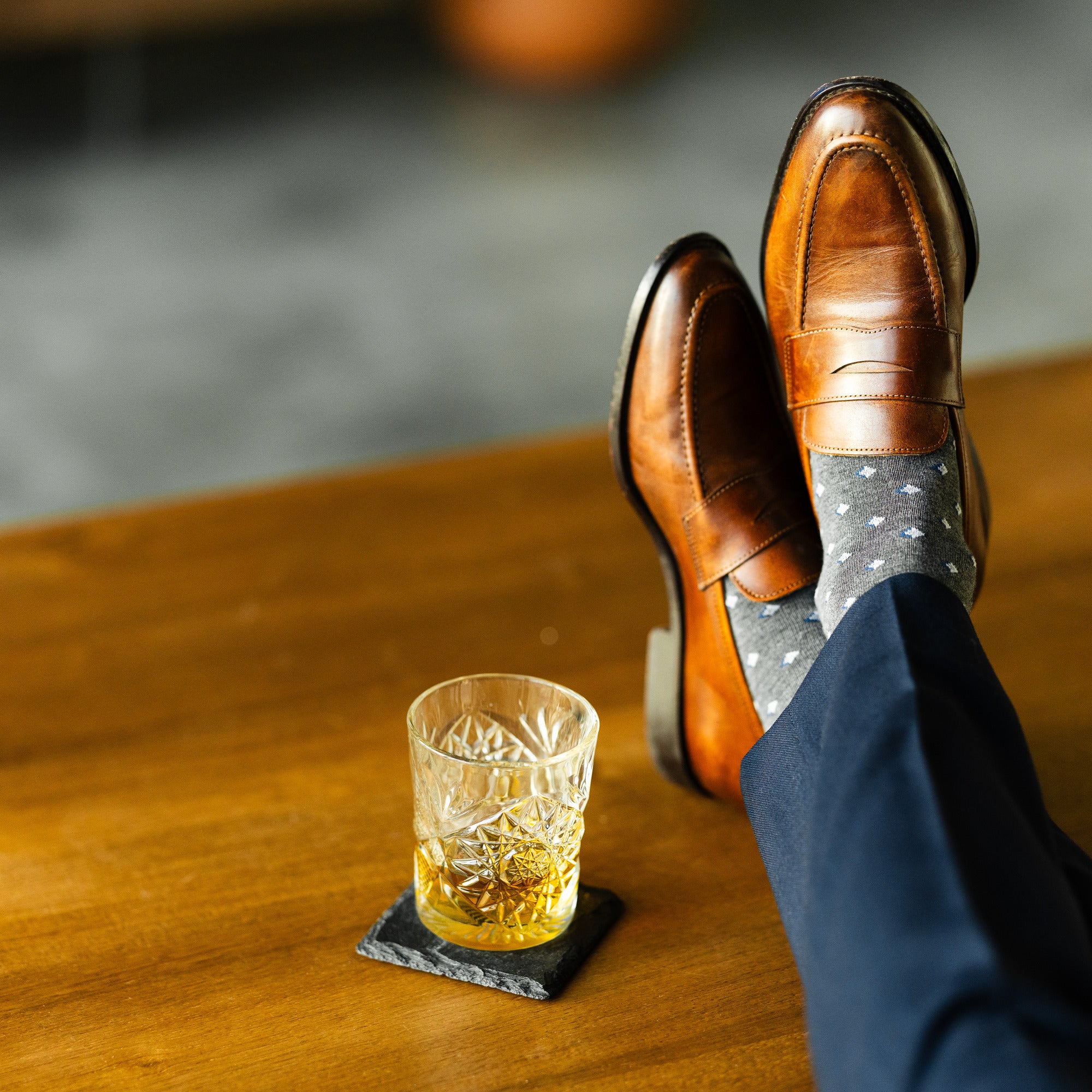 Grey Gemstones dress socks with navy trousers and brown penny loafers