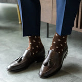 A chocolate brown men's dress sock with cream Fleur De Lis