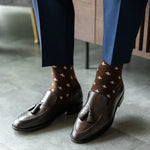 A chocolate brown men's dress sock with cream Fleur De Lis