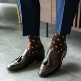 A chocolate brown men's dress sock with cream Fleur De Lis