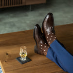A chocolate brown men's dress sock with cream Fleur De Lis