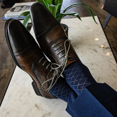 deep blue men's dress sock with contrasting diamond pattern