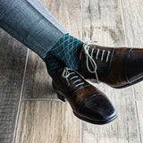 Deep green men's dress sock with contrasting diamond pattern