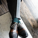 Deep green men's dress sock with contrasting diamond pattern