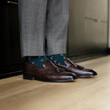 deep green men's dress sock with a white t-sun pattern