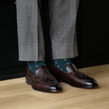 deep green men's dress sock with a white t-sun pattern