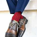 a deep red men's dress sock with a contrasting diamond pattern