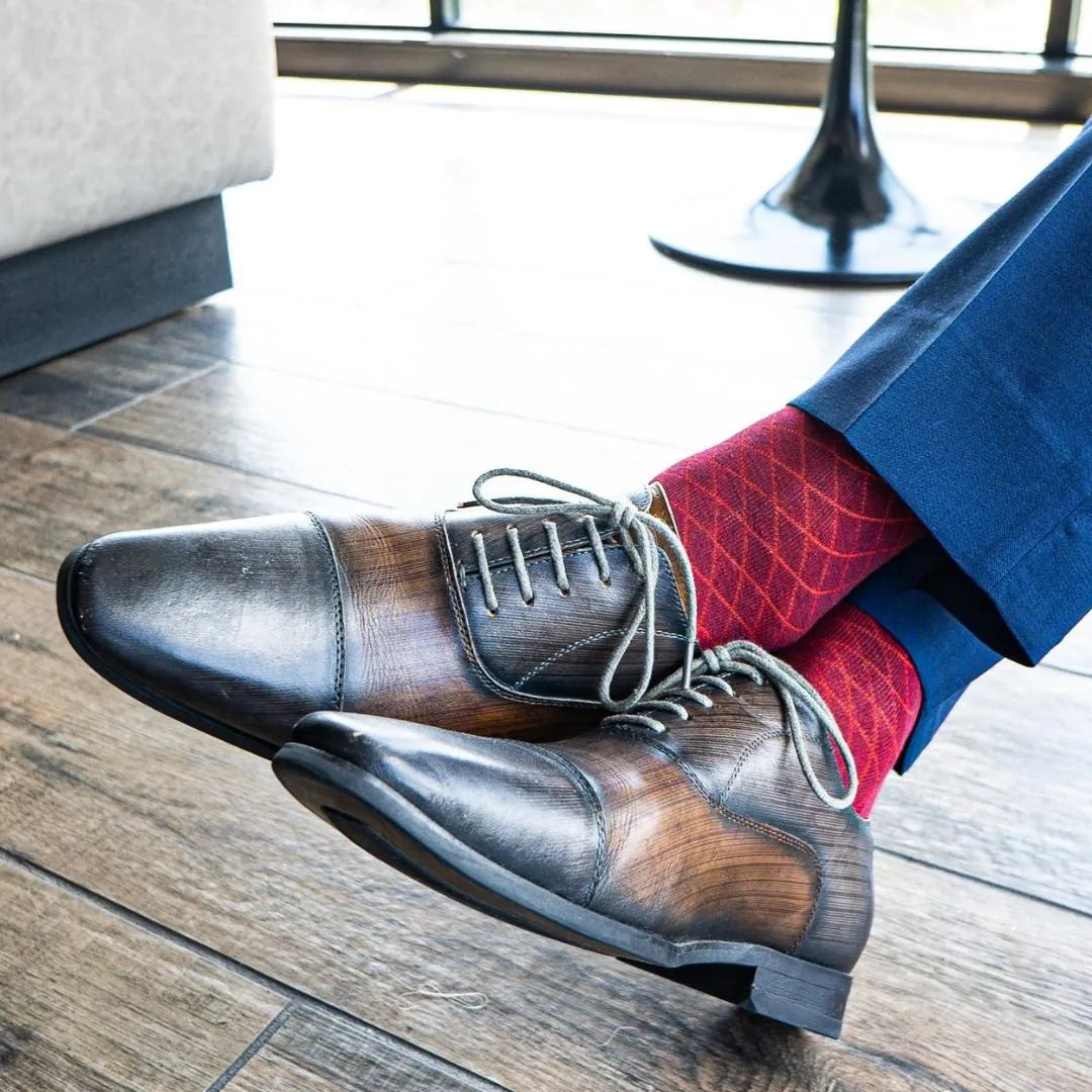 a deep red men's dress sock with a contrasting diamond pattern