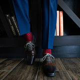 a deep red men's dress sock with a contrasting diamond pattern
