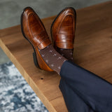 An Espresso Brown Sock with White T-Suns