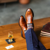 Mocha Multi-Stripe men's dress sock — mocha sock with espresso, teal, and pale blue stripes lifestyle image