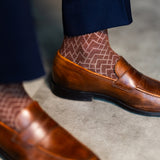 Pecan & Cream Stepped Chevron men's dress sock — pecan brown sock with a cream stepped chevron pattern lifestyle image