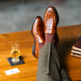 Pecan & Navy Diamonds men's dress sock — pecan brown sock with a navy diamond pattern styled with olive trousers