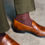 Pecan & Navy Diamonds men's dress sock — pecan brown sock with a navy diamond pattern styled with olive trousers