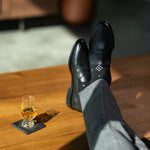 The Black Nested Diamonds men's dress sock — black sock with grey nested diamonds lifestyle image