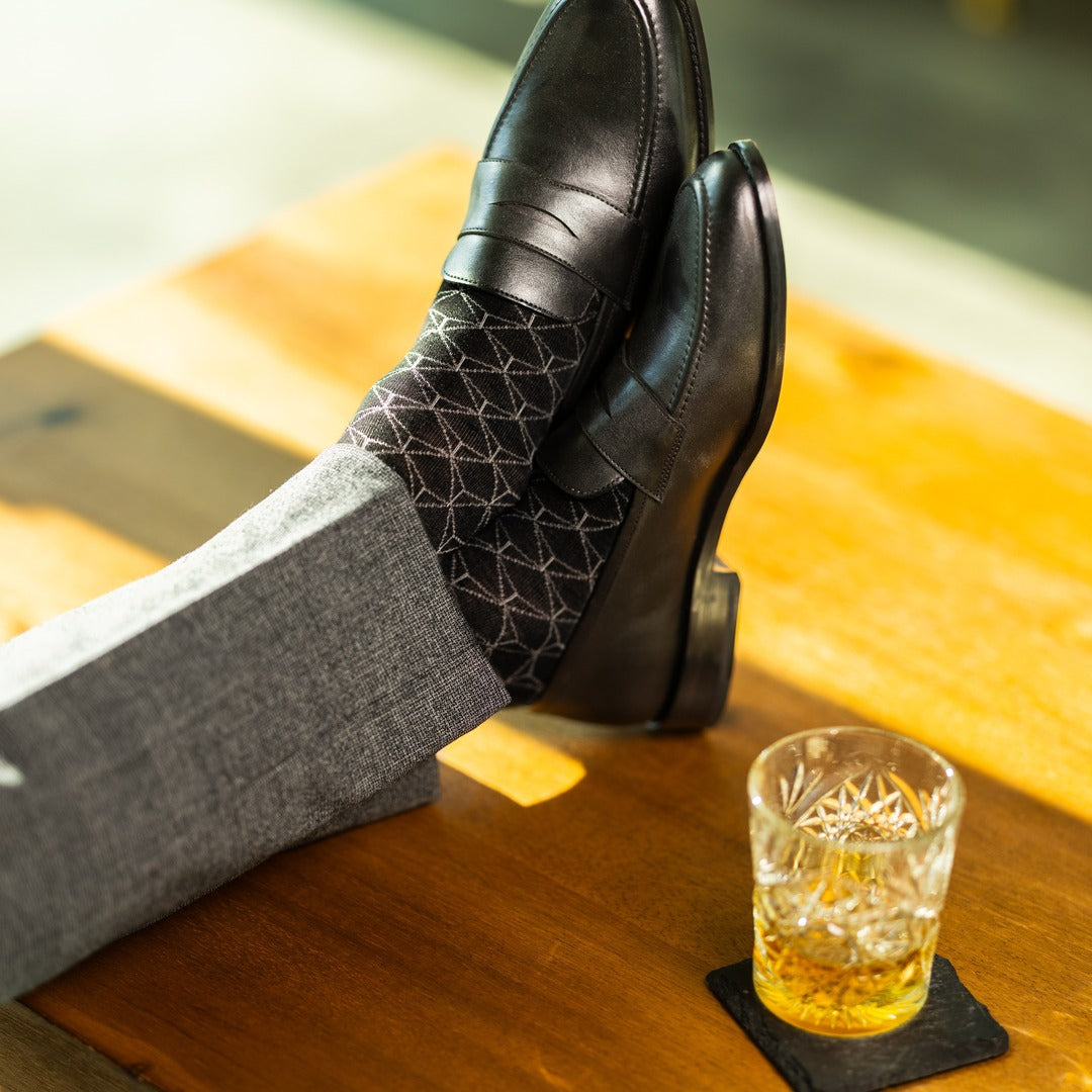 The Black & Silver Lattice men's dress sock — black sock with a silver lattice pattern lifestyle image